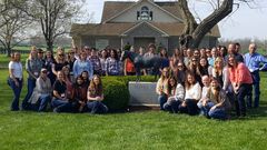 group photo standing around the Seattle Slew statue
